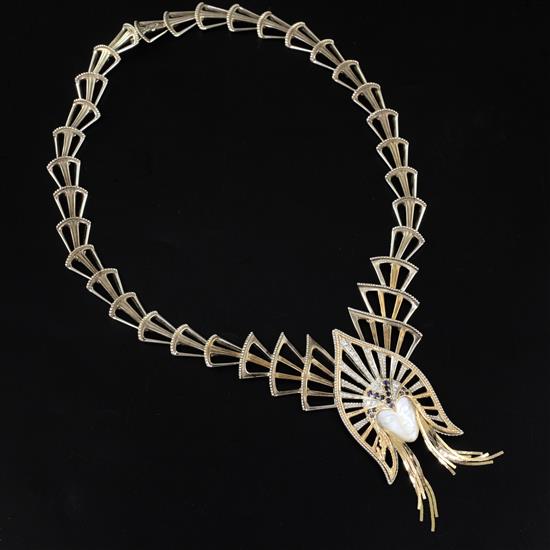 An Erte Mystere mother of pearl, diamond and sapphire set gold and silver necklace, with pendant brooch, limited to 500 pieces,